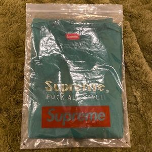 Supreme shirt. New in original bag. Free Supreme bag and sticker w/ purchase.